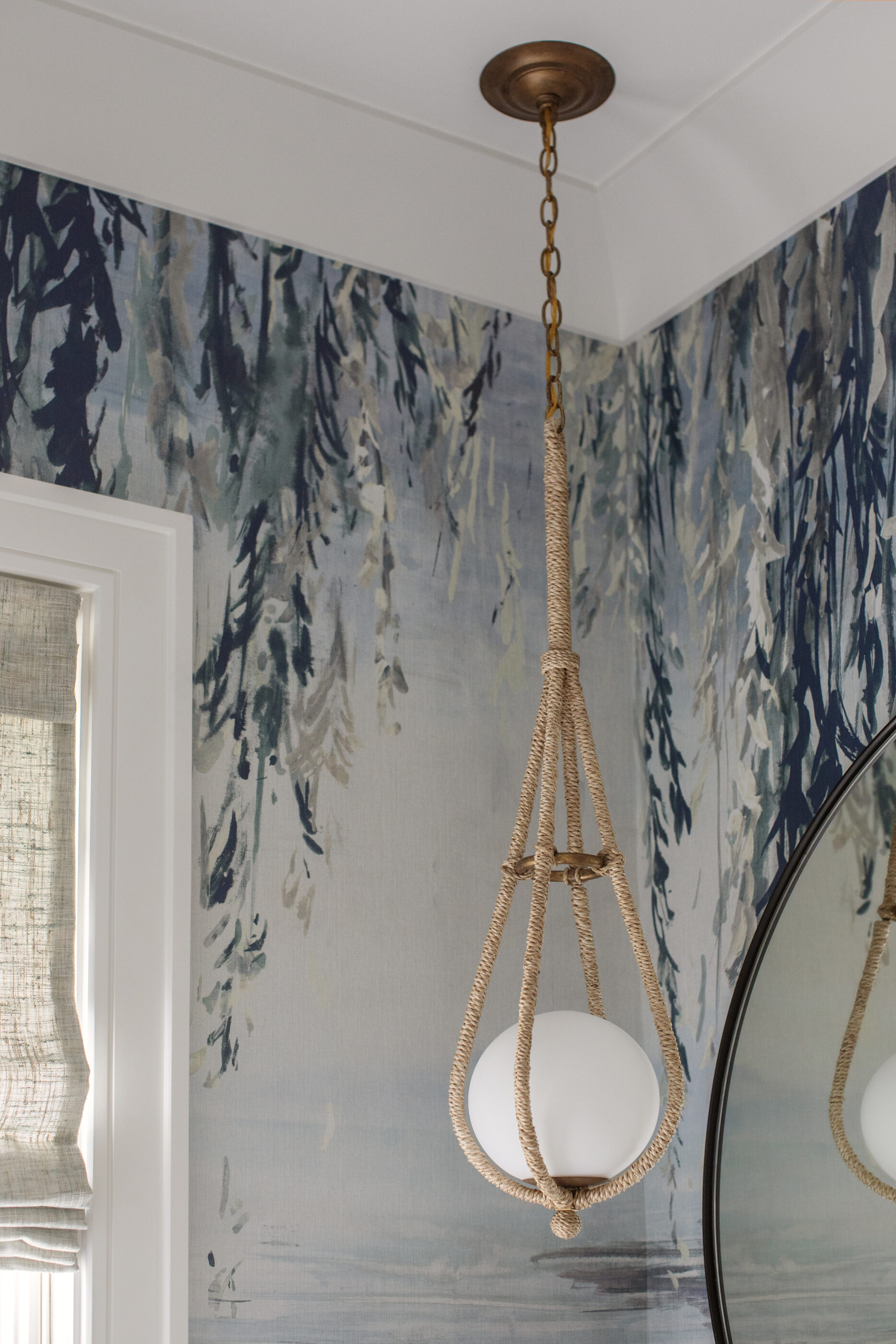 “Lowcountry luxury interior design by Megan Molten featuring coastal modern style, custom upholstery, woven textures, and statement lighting in a serene Kiawah home. Soft blues, neutrals, and sandy tones create an airy atmosphere across kitchen, living room, bedroom, bathroom, and poolside spaces