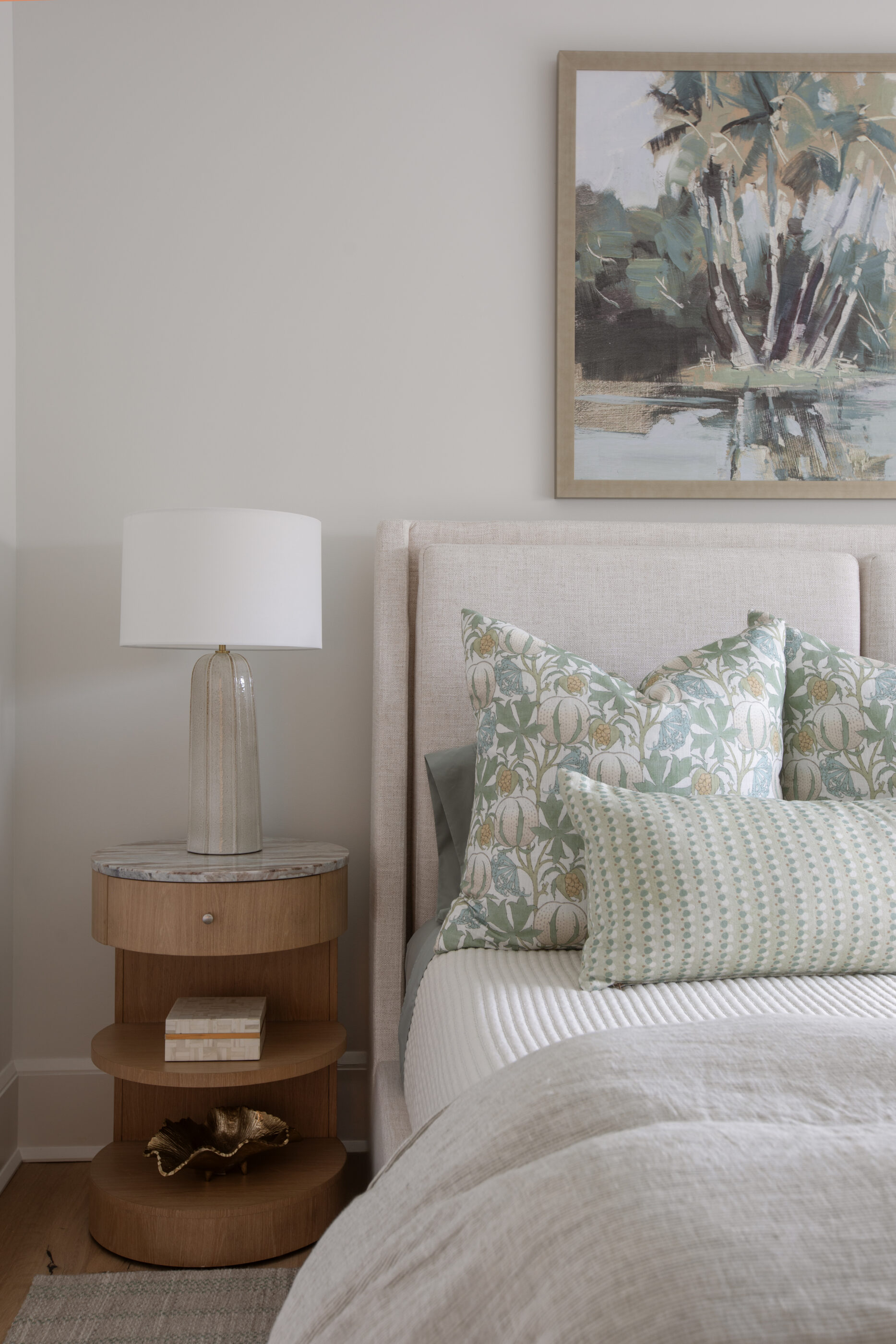 “Lowcountry luxury interior design by Megan Molten featuring coastal modern style, custom upholstery, woven textures, and statement lighting in a serene Kiawah home. Soft blues, neutrals, and sandy tones create an airy atmosphere across kitchen, living room, bedroom, bathroom, and poolside spaces