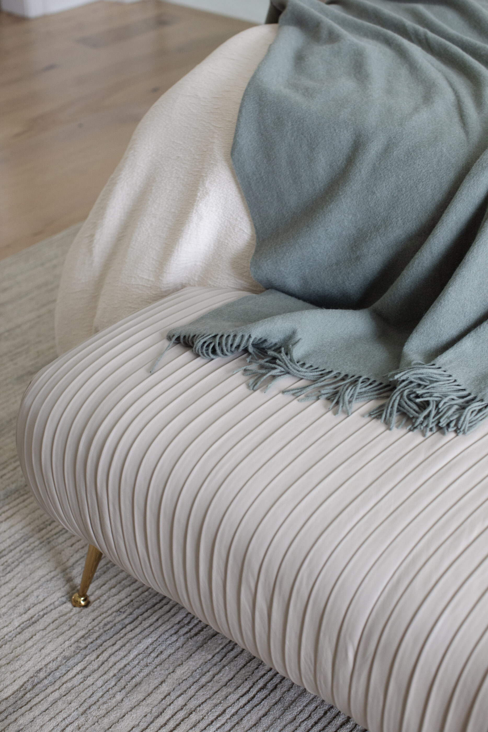 “Lowcountry luxury interior design by Megan Molten featuring coastal modern style, custom upholstery, woven textures, and statement lighting in a serene Kiawah home. Soft blues, neutrals, and sandy tones create an airy atmosphere across kitchen, living room, bedroom, bathroom, and poolside spaces