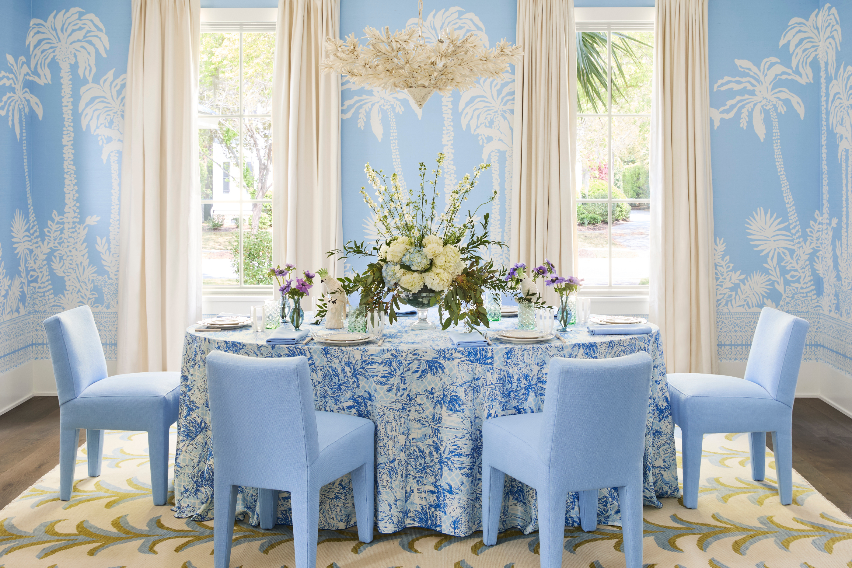 Interior design by Megan Molten for a coastal, vibrant Mount Pleasant home featuring the Lilly Pulitzer x Lee Jofa collection blue dining room palm perfect