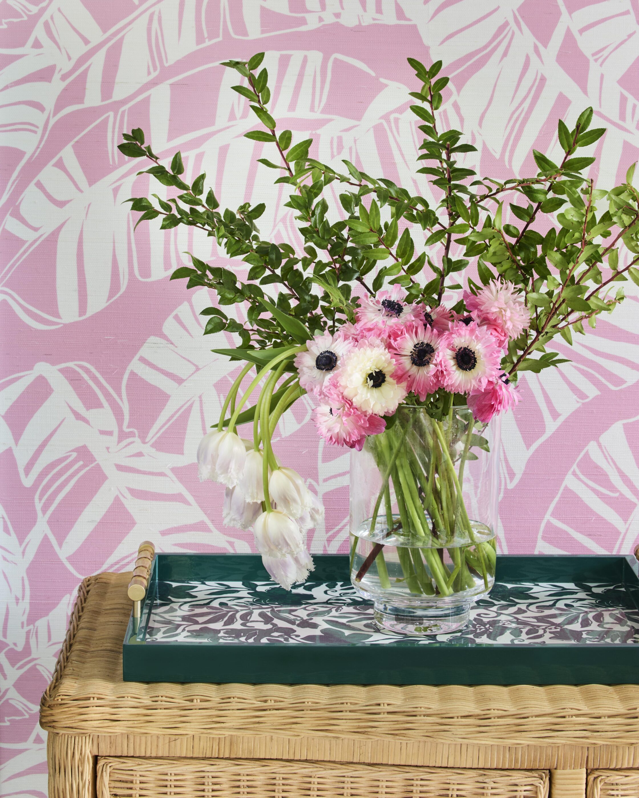 styled interior wicker pink florals game room sun room Interior design by Megan Molten for a coastal, vibrant Mount Pleasant home featuring the Lilly Pulitzer x Lee Jofa collection