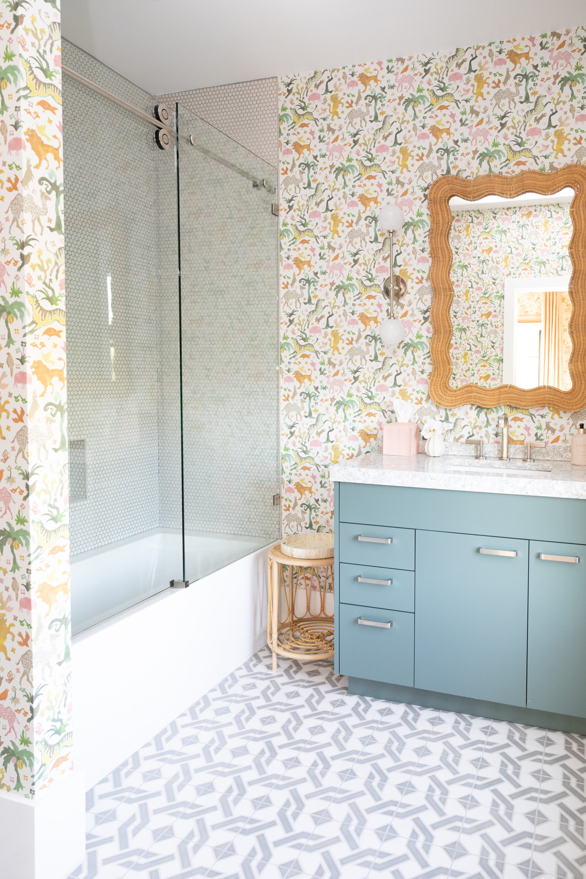 Interior design by Megan Molten for a coastal, vibrant Mount Pleasant home childs bathroom wallpaper animals