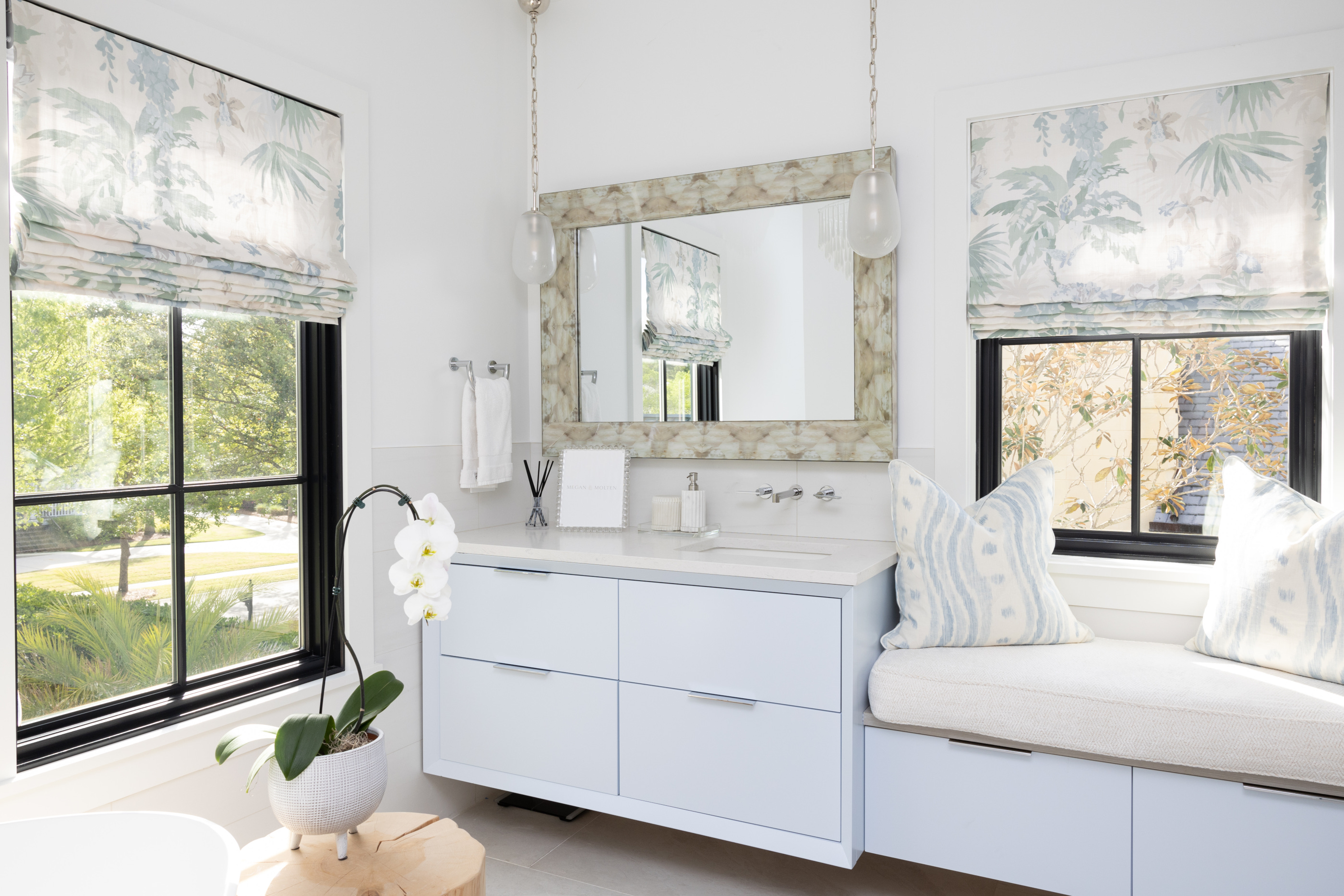 Interior design by Megan Molten for a coastal, vibrant Mount Pleasant home featuring the Lilly Pulitzer x Lee Jofa collection primary serene bathroom bench mirror